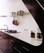 space pod kitchen below a flight of stairs