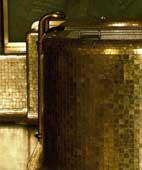 Close-up of gold mosaic bathtub