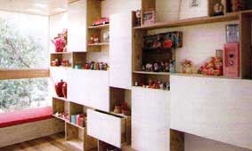 Clever wall cabinets act as a display cum storage in the children's room