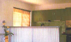 Striped Spashback Blends Well with Venetian Blinds and Contrasts with Verticle Stripes on Bar